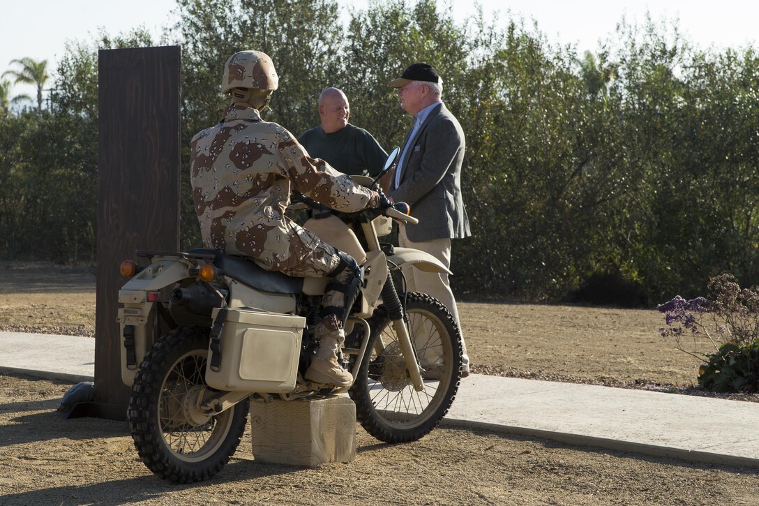 Attendees of the 75th Annual Evening Colors Ceremony view the displays set out in the garden at the Pacific Views Center on Camp Pendleton, Calif., Sept. 29, 2017. Evening colors commemorates the anniversary of the dedication of the base, this year’s ceremony also honors the 75th anniversary of Camp Pendleton. (U. S. Marine Corps photo by Lance Cpl. Betzabeth Y. Galvan)