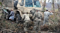 Soldiers clear debris.