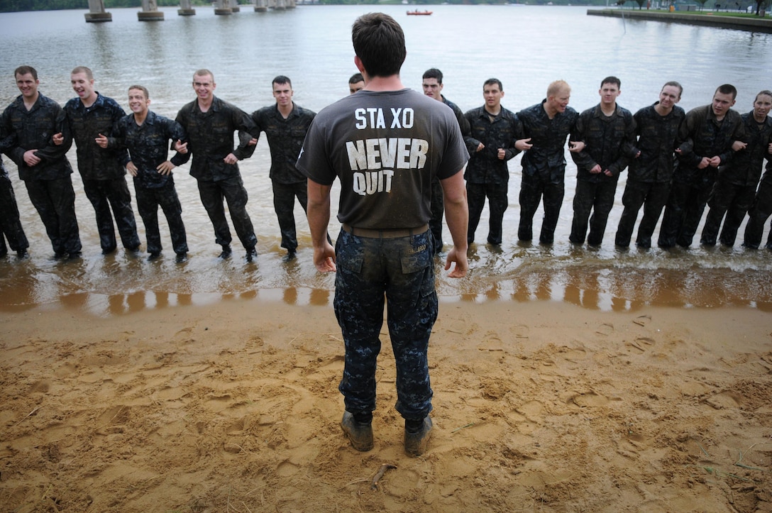 An upperclass midshipman gives a briefing to first-year midshipmen, or plebes, participating in the annual Sea Trials at the U.S. Naval Academy