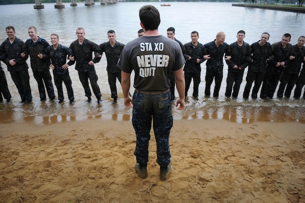 ANNAPOLIS, Md. (May 15, 2012) An upperclass midshipman gives a briefing to first-year midshipmen, or plebes, participating in the annual Sea Trials at the U.S. Naval Academy. Sea Trials is modeled after the Marine Corps’ Crucible and the Navy’s Battle Stations recruit programs. It is a capstone event for the fourth class midshipmen and serves as a leadership challenge for the upper class midshipmen who lead each event during the exercise. (U.S. Navy photo by Mass Communication Specialist 1st Class Chad Runge/Released)