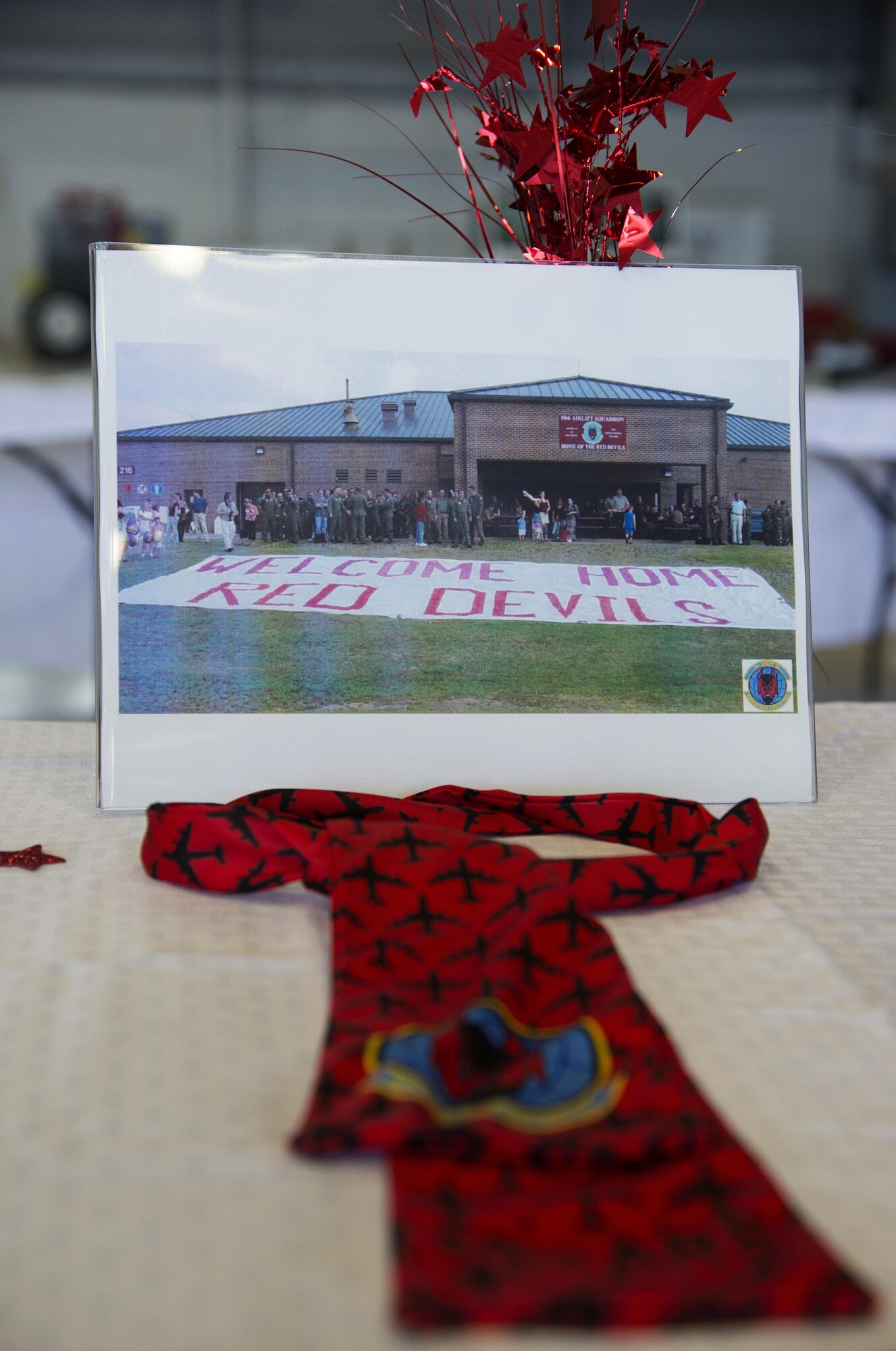 A welcome home photo sits on a table during the 50th Air Refueling Squadron’s (ARS) assumption of command ceremony at MacDill Air Force Base, Fla., Oct. 2, 2017.