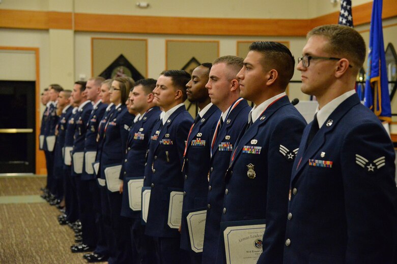 Airmen hold their graduation certificates during an Airman Leadership School graduation ceremony at the Grizzly Bend Sept. 27, 2017, at Malmstrom Air Force Base, Mont. Thirty Airmen from Malmstrom and the 120th Airlift Wing graduated during the ceremony. (U.S. Air Force photo/Airman 1st Class Daniel Brosam)