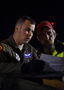 Airman 1st Class Patrick Schmidt, 15th Airlift Squadron loadmaster, reviews a checklist at Fort Drum, N.Y., Sept. 28th, 2017.