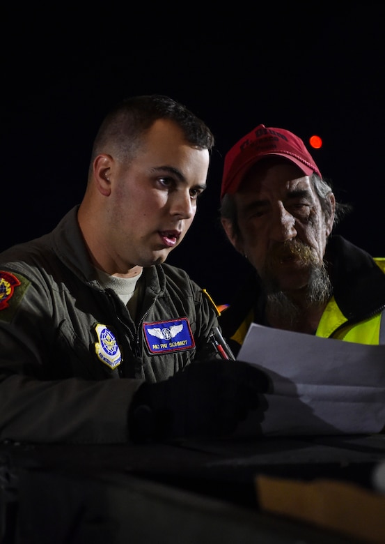 Airman 1st Class Patrick Schmidt, 15th Airlift Squadron loadmaster, reviews a checklist at Fort Drum, N.Y., Sept. 28th, 2017.