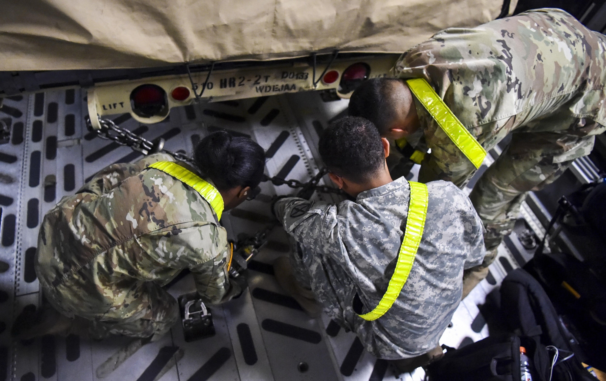 Soldiers from the 510th Human Resources Company secure a Humvee in the cargo bay of C-17 Globemaster III at Fort Drum, N.Y., Sept. 28th, 2017.