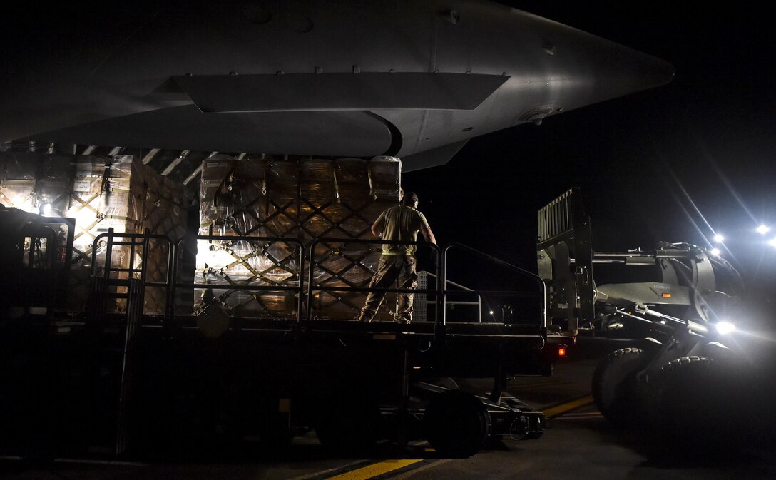 Pallets of food and water are offloaded at San Juan, Puerto Rico, Sept. 30th, 2017.