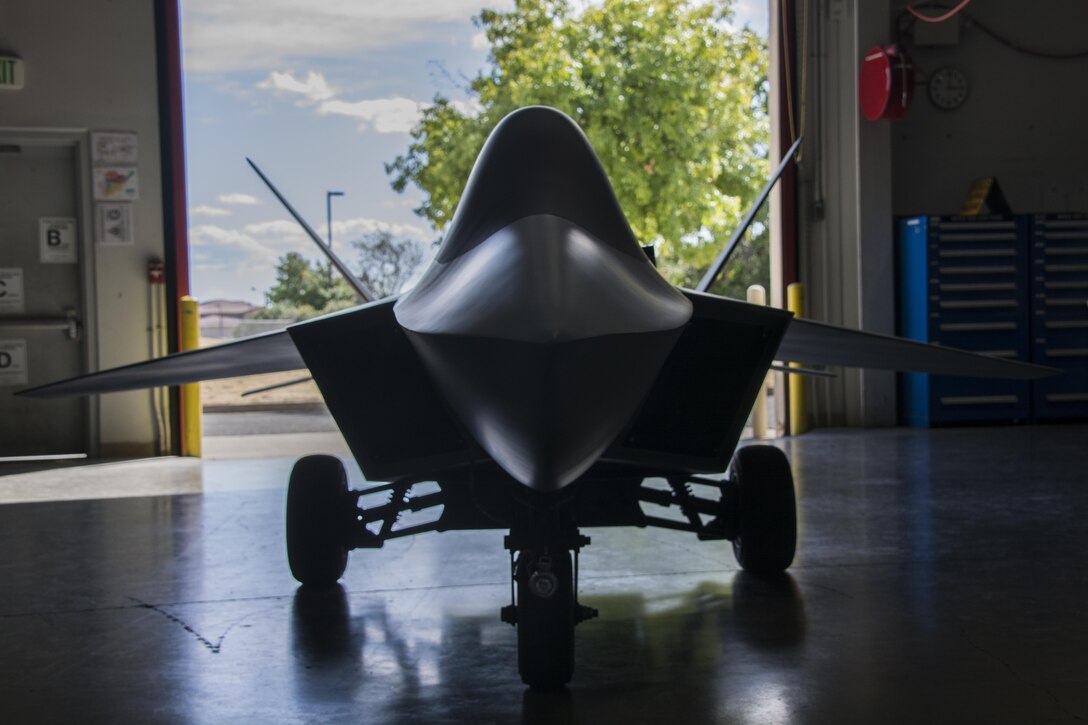 A model F-22 Raptor, refurbished and restored by the 60th Maintenance Squadron fabrication flight, is parked inside Building 803 to be delivered to recruiters with the 364th Recruiting Squadron Sept. 21 from McCellan Air Force Base, Calif. The model F-22 has brought the 60th MXS team closer together as many volunteers worked together in completing the refurbishment.