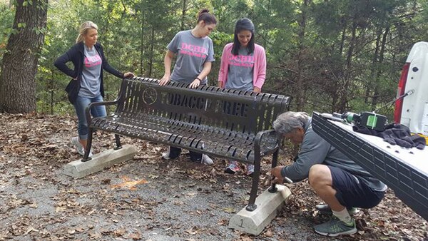 Volunteers install a park bench along “The Old 56 Trail” at Center Hill Lake in support of National Public Lands Day Sept. 30, 2017.  The U.S. Army Corps of Engineers Nashville District coordinated with the DeKalb County Health Department on the development of the trail, and garnered additional support from Tennessee Tech University’s Fisheries Society, DeKalb County High School, and other volunteers and partnerships. (USACE photo by Park Ranger Sarah Peace)