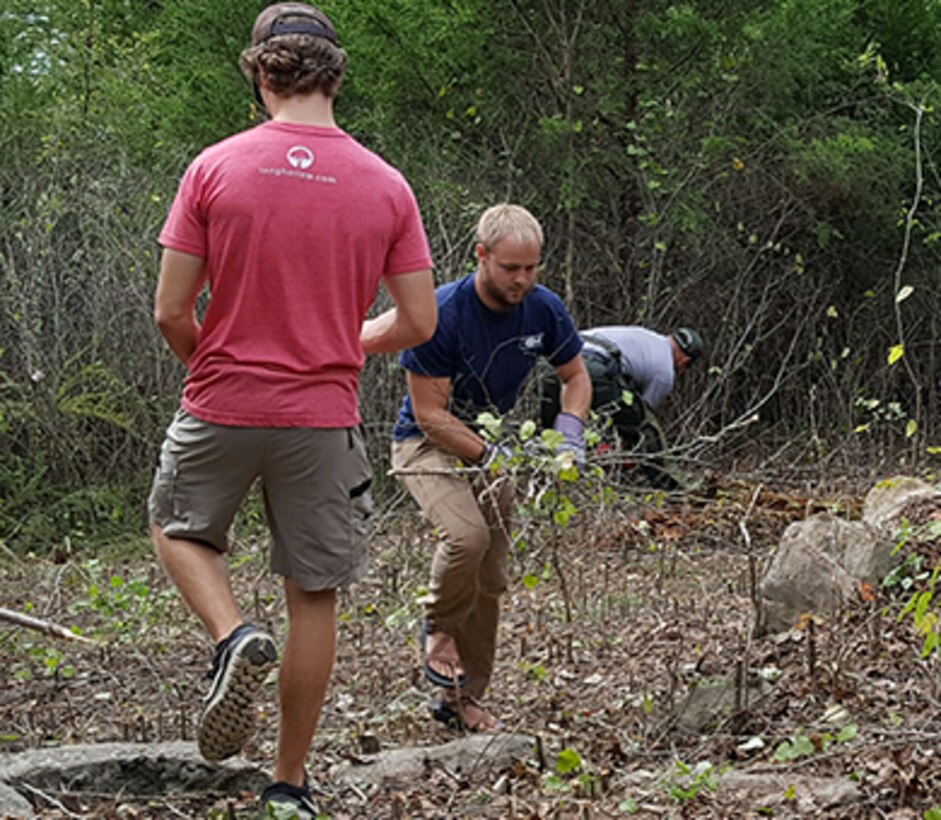 Volunteers remove small brush and overgrowth along “The Old 56 Trail” at Center Hill Lake in support of National Public Lands Day Sept. 30, 2017.  The U.S. Army Corps of Engineers Nashville District coordinated with the DeKalb County Health Department on the development of the trail, and garnered additional support from Tennessee Tech University’s Fisheries Society, DeKalb County High School, and other volunteers and partnerships. (USACE photo by Park Ranger Sarah Peace)