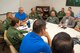 WRIGHT-PATTERSON AIR FORCE BASE, Ohio – Aeromedical Consultation Service Deputy Chief Dr. Daniel Van Syoc (left in blue) oversees a case review session with flight surgeons and other medical professionals, some of which are the world experts in their fields. The ACS has screened new pilots and made waiver recommendations for existing air crews since the early 1950s. (U.S. Air Force photo/John Harrington)