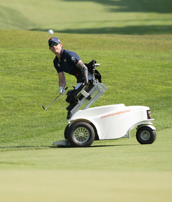Marine Corps veteran Sgt. Michael Nicholson competes in golf at St. George's Golf and Country Club during the 2017 Invictus Games.