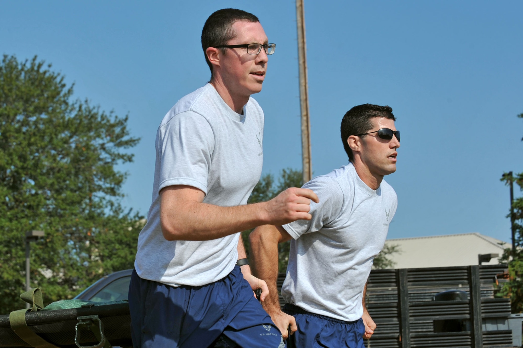 U.S. Air Force Capt. Ryan Scott, 20th Medical Operations Squadron physical therapist, left, and Capt. John Kauderman, 20th Aerospace Medicine Squadron optometrist, carry a litter during a Warrior Day commander’s challenge at Shaw Air Force Base, S.C., Sept. 29, 2017.