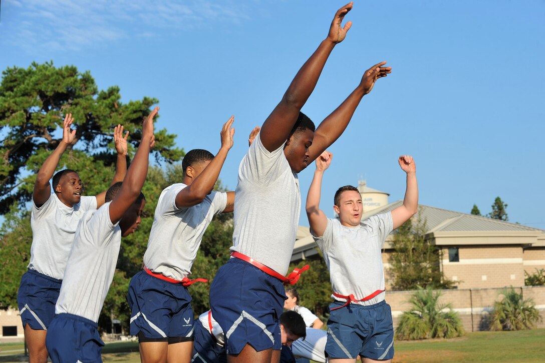U.S. Airmen perform burpees during a Warrior Day at Shaw Air Force Base, S.C., Sept. 29, 2017.