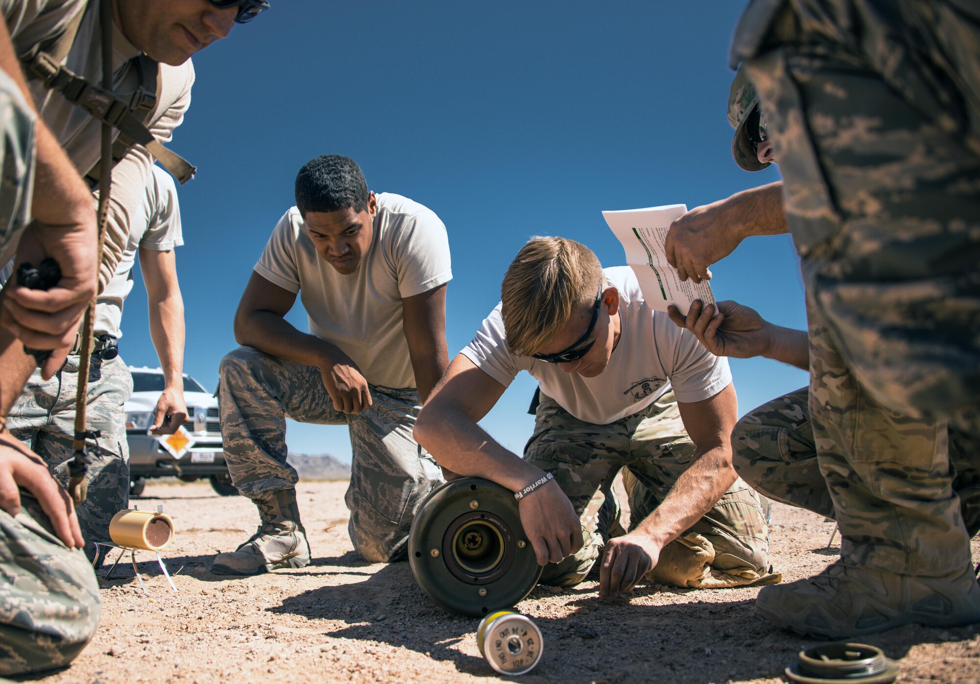Senior Airman Jared Ball, 56th Civil Engineer Squadron explosive ordinance disposal team member, performs render safe procedures on a Mark 81 bomb at the Gila Bend Air Force Auxiliary Field in Gila Bend, Ariz., Sept. 21, 2017. The render safe procedure is the act of applying special EOD procedures, methods and tools to provide the interruption of functions or separations of essential components of unexploded ordnance to prevent an unacceptable detonation. (U.S. Air Force photo/Airman 1st Class Alexander Cook)