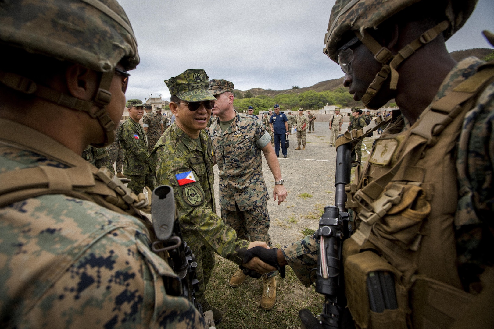 Gen. Eduardo Manahan Ano shakes U.S. Marine Corps LCpl. Barrett’s hand at Marine Corps Training Area Bellows Beach, Hawaii, Sept. 29, 2017. Ano is the Chief of Staff of the Armed Forces of the Philippines. Urban Operations is an opportunity to demonstrate the U.S. Marine Corps’ capability to the component commanders and the Chief of Staff of the AFP. (U.S. Marine Corps photo by Cpl. Robert Sweet)