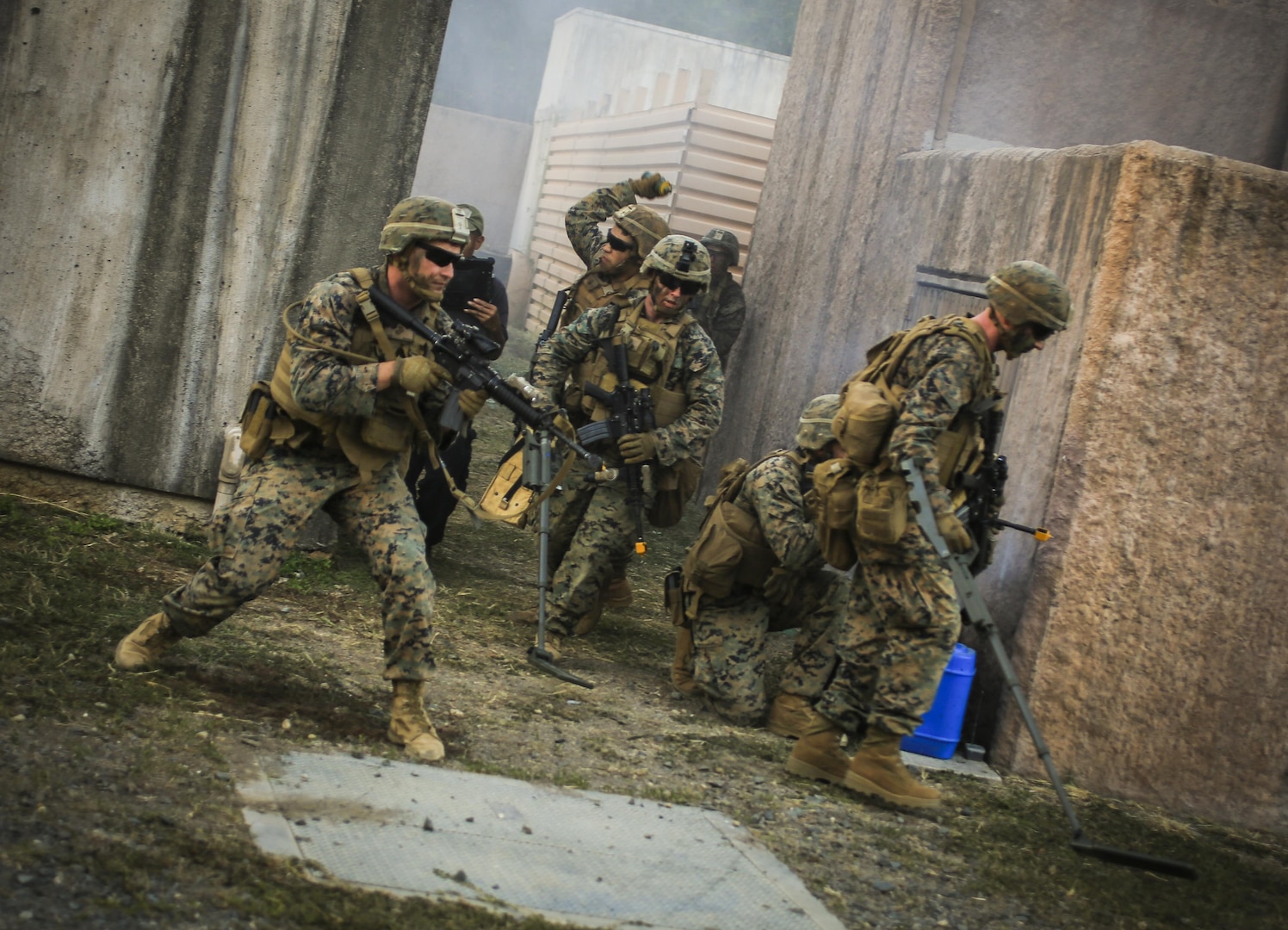 U.S. Marines with 2nd Battalion, 3rd Marines, clear for secondary improvised explosive devices during urban operations training at Marine Training Area Bellows, Hawaii, Sept. 28, 2017. Urban Operations is an opportunity to demonstrate the U.S. Marine Corps capability to component commanders and the Chief of Staff of the Armed Forces of the Philippines. (U.S. Marine Corps photo by Sgt. Wesley Timm)