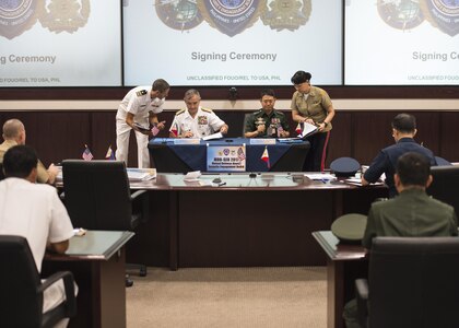 CAMP H.M. SMITH, Hawaii (Sept. 28, 2018)—Adm. Harry Harris, Commander of U.S. Pacific Command (PACOM), and Gen. Eduardo Año, Chief of Staff for the Armed Forces of the Philippines, review paperwork for the Mutual Defense Board (MDB) and Security Engagement Board (SEB). During Año’s two-day visit to PACOM, he and Harris discussed changes to the MDB and SEB. The MDB provides direct liaison and consultation on military matters of mutual concern to develop and improve both countries’ common defense. The SEB provides the framework and mechanism for continuing liaison and consultation on non-traditional threats to security such as terrorism, transnational crimes, maritime security, and natural and man-made disasters. (U.S. Navy photo by Mass Communication Specialist 2nd Class James Mullen/Released)