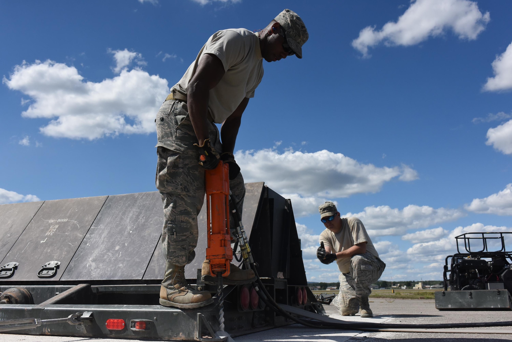 Electrical power production craftsmen from the 138th Fighter Wing from the Tulsa Air National Guard Base in Tulsa, Oklahoma and 137th Special Operations Wing from Will Rogers Air National Guard Base in Oklahoma City install components for a mobile aircraft arresting system at the Silver Flag training site at Ramstein Air Base, Germany, Aug. 7, 2017. The training was part of an exercise that allowed Oklahoma Air National Guardsmen from the 137th Special Operations Wing, Will Rogers Air National Guard Base, Oklahoma City, and the 138th Fighter Wing, Tulsa Air National Guard Base, Tulsa, Oklahoma, to integrate different career fields and units for a realistic contingency environment. (U.S. Air National Guard photo by Senior Airman Caitlin G. Carnes/Released)