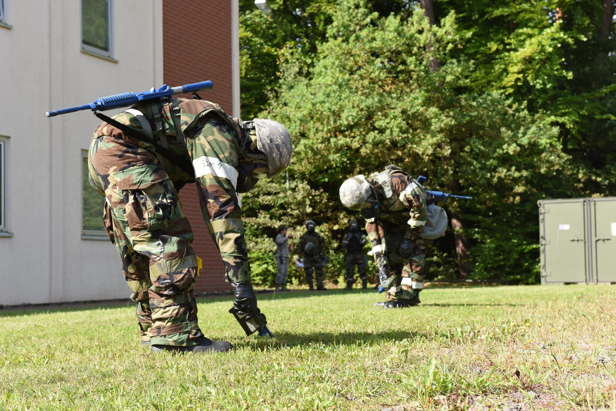 Emergency management specialists practice chemical warfare tasks during a simulated attack at the Silver Flag training site at Ramstein Air Base, Germany, Aug. 9, 2017. he training was part of an exercise that allowed Oklahoma Air National Guardsmen from the 137th Special Operations Wing, Will Rogers Air National Guard Base, Oklahoma City, and the 138th Fighter Wing, Tulsa Air National Guard Base, Tulsa, Oklahoma, to integrate different career fields and units for a realistic contingency environment.(U.S. Air National Guard photo by Senior Airman Caitlin G. Carnes/Released)