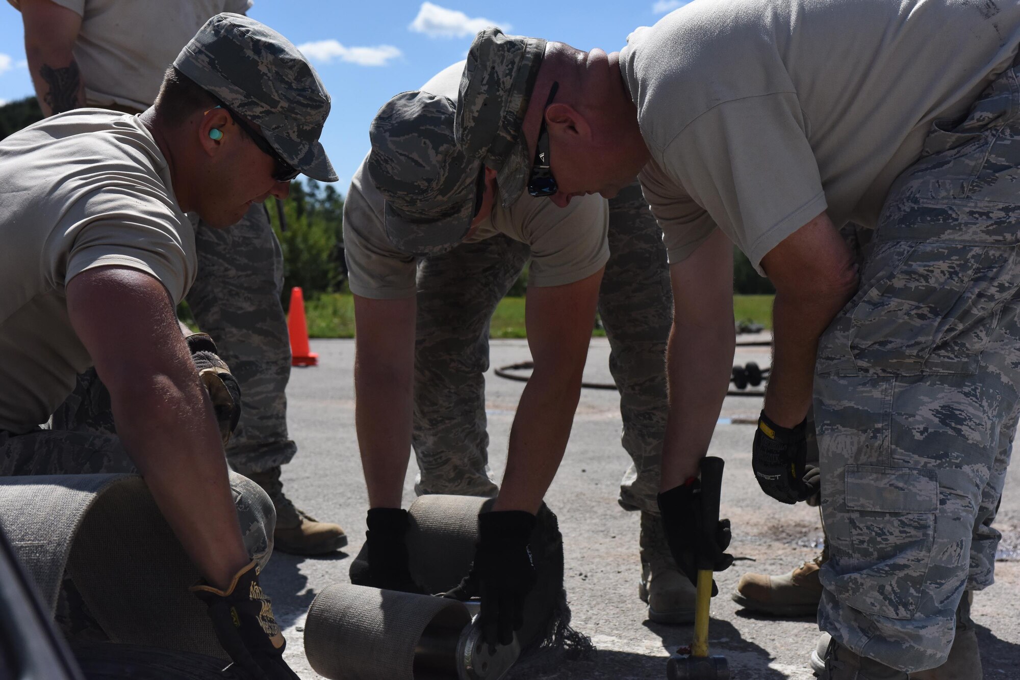 Electrical power production craftsmen from the 138th Fighter Wing from the Tulsa Air National Guard Base in Tulsa, Oklahoma and 137th Special Operations Wing from Will Rogers Air National Guard Base in Oklahoma City install components for a mobile aircraft arresting system at the Silver Flag training site at Ramstein Air Base, Germany, Aug. 7, 2017. The training was part of an exercise that allowed Oklahoma Air National Guardsmen from the 137th Special Operations Wing, Will Rogers Air National Guard Base, Oklahoma City, and the 138th Fighter Wing, Tulsa Air National Guard Base, Tulsa, Oklahoma, to integrate different career fields and units for a realistic contingency environment. (U.S. Air National Guard photo by Senior Airman Caitlin G. Carnes/Released)