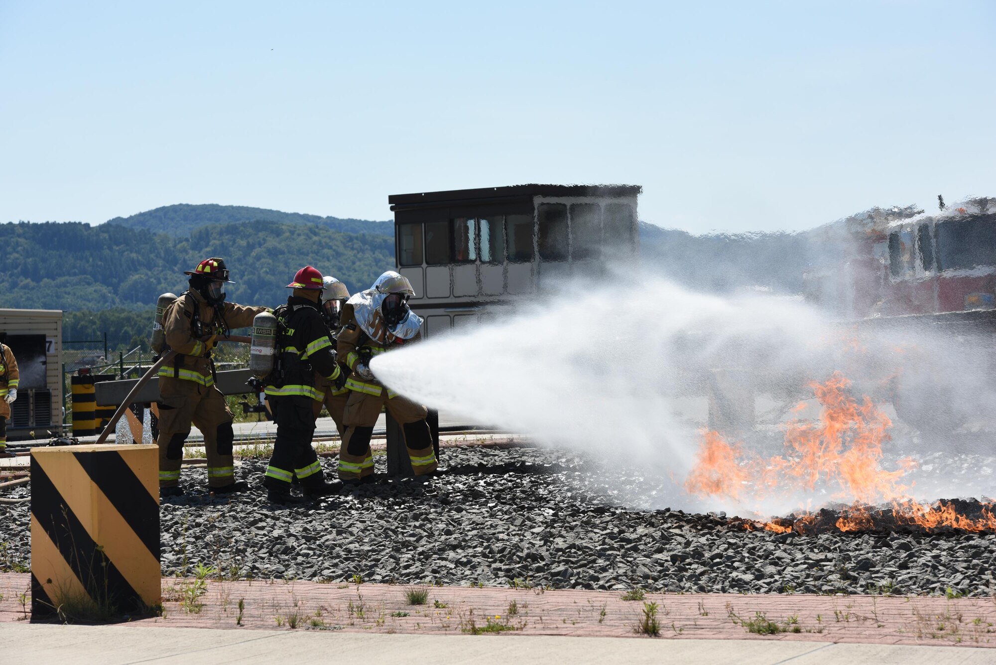 Air National Guard firefighters practice combating aircraft fires at the Silver Flag training site at Ramstein Air Base, Germany, Aug. 8, 2017. The training was part of an exercise that allowed Oklahoma Air National Guardsmen from the 137th Special Oeperations Wing, Will Rogers Air National Guard Base, Oklahoma City, and the 138th Fighter Wing, Tulsa Air National Guard Base, Tulsa, Oklahoma, to integrate with different career fields and units for a realistic contingency environment. (U.S. Air National Guard photo by Capt. Micah D. Campbell/Released)