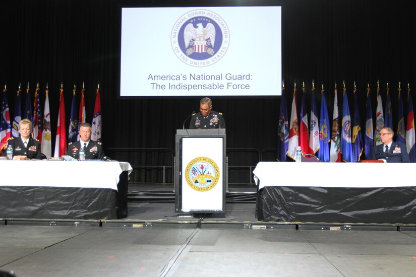 Lt. Gen. Michael Garrett gives his speech from a podium on stage.