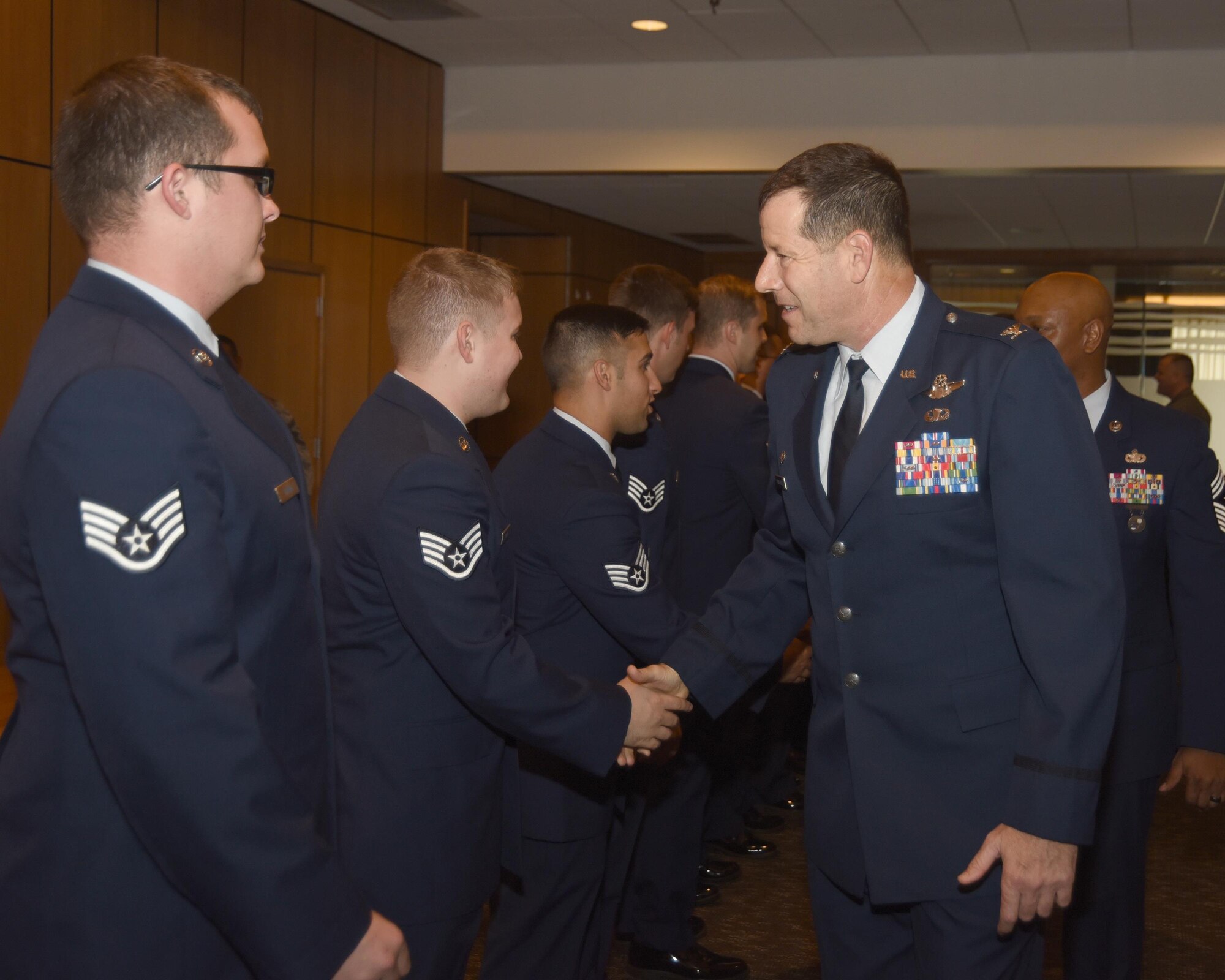 U.S. Air Force colonel congratulates Airmen