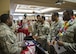 Airmen learn about a new culture from Tech Sgt. Willie Neal, 23d Maintenance Squadron munitions specialist during Diversity Day, Sept. 29, 2017, at Moody Air Force Base, Ga. Moody held Diversity Day to honor and educate Airmen on all of the ethnic groups and organizations observed by the Department of Defense. (U.S. Air Force Photo by Airman Eugene Oliver)