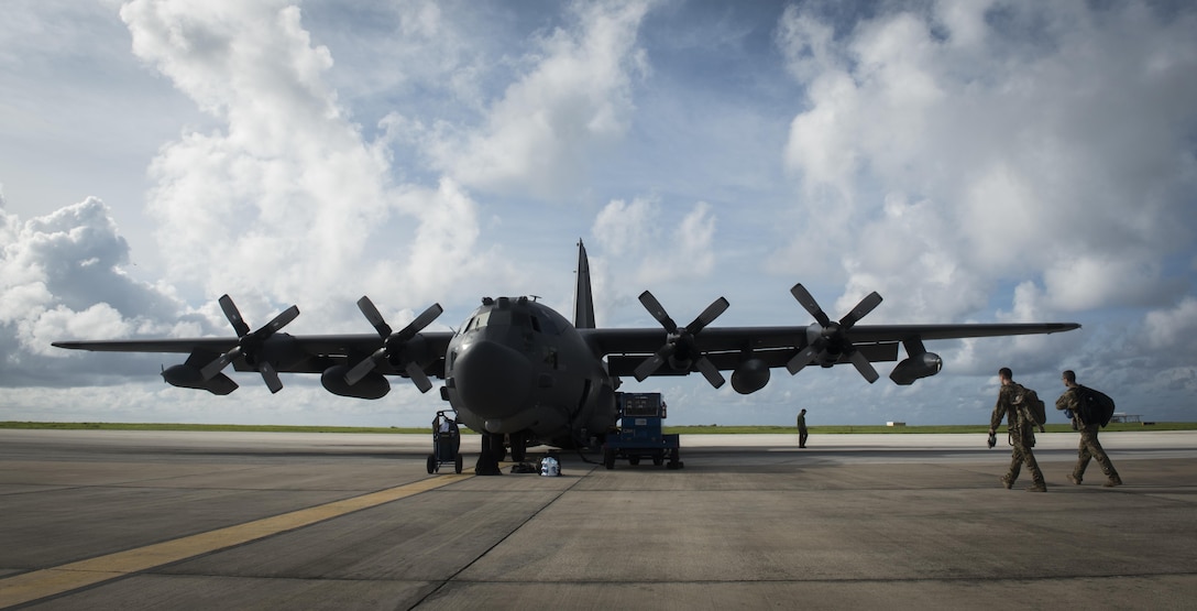 Loadmasters with the 15th Special Operations Squadron walk to an MC-130H Combat Talon II at Barbados