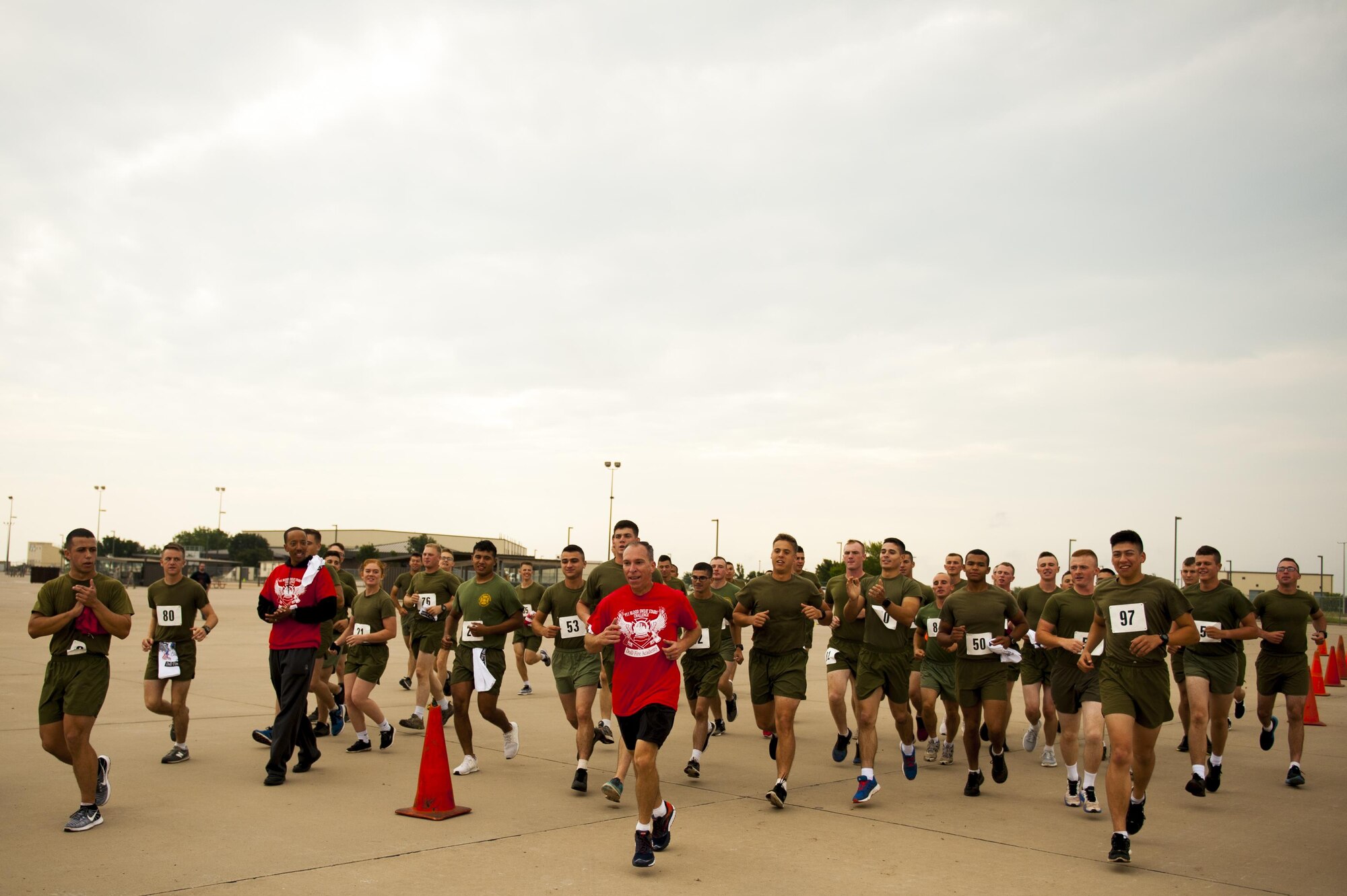 U.S. Air Force Lt. Col. Scott Cline, 312th Training Squadron commander, finishes the Blood, Sweat and Stairs event to the rally of volunteers who participated in the event at the Louis F. Garland Department of Defense Fire Academy on Goodfellow Air Force Base, Texas, Sept. 30, 2017. Cline went last as a non-competitor. (U.S. Air Force photo by Senior Airman Scott Jackson/Released)