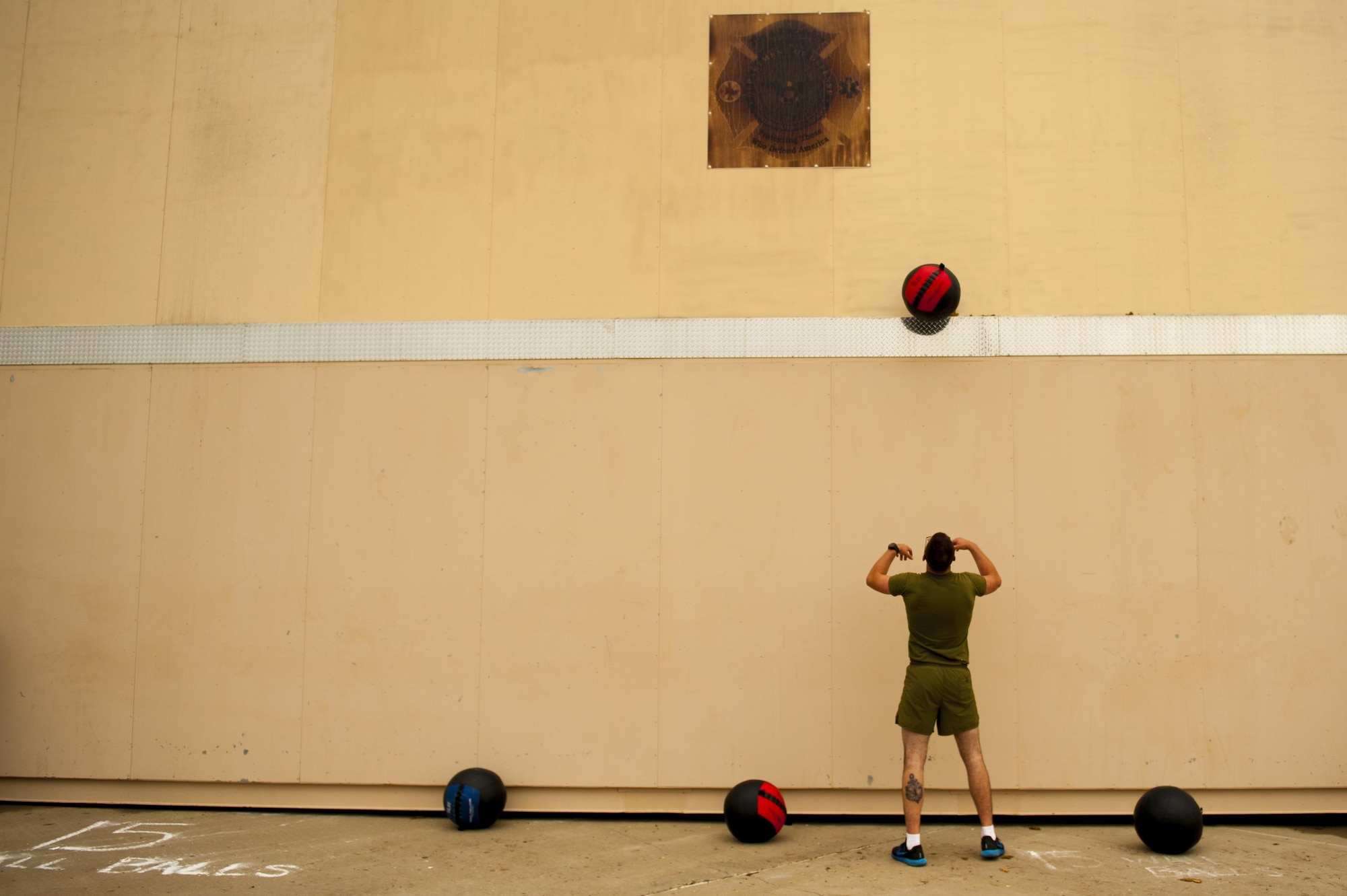 U.S. Marine Corps Pfc. Matthew Buenrostro, 312th Training Squadron trainee, performs a wall-ball exercise during the fourth annual Blood, Sweat and Stairs event at the Louis F. Garland Department of Defense Fire Academy on Goodfellow Air Force Base, Texas, Sept. 30, 2017. Blood, Sweat and Stairs is a circuit event comprised of numerous exercises spread out across the academy’s. (U.S. Air Force photo by Senior Airman Scott Jackson/Released)
