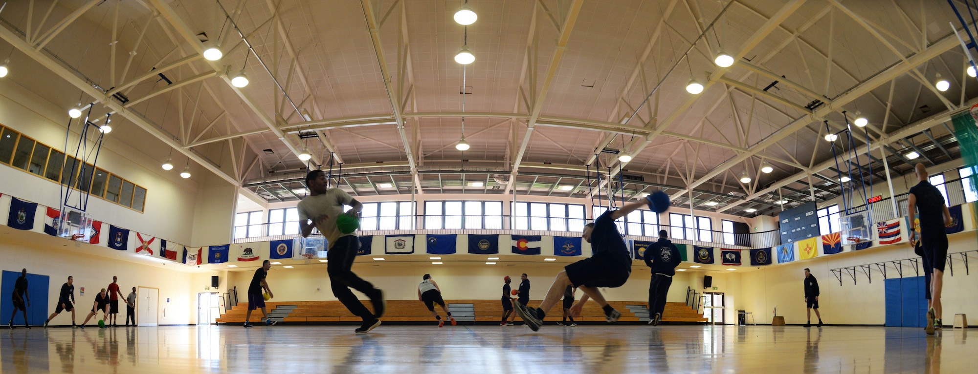 Airmen from the 100th Security Forces Squadron and 100th Civil Engineer Squadron compete against the 48th Civil Engineer Squadron firefighters in a game of dodgeball during the Battle of the Badges, Sept. 30, 2017, on RAF Mildenhall, England. The Battle of the Badges is hosted annually and rotates between RAF Mildenhall and RAF Lakenheath. Instead of declaring winners, the event is designed to build camaraderie among first responders. (U.S. Air Force photo by Airman 1st Class Alexandria Lee)