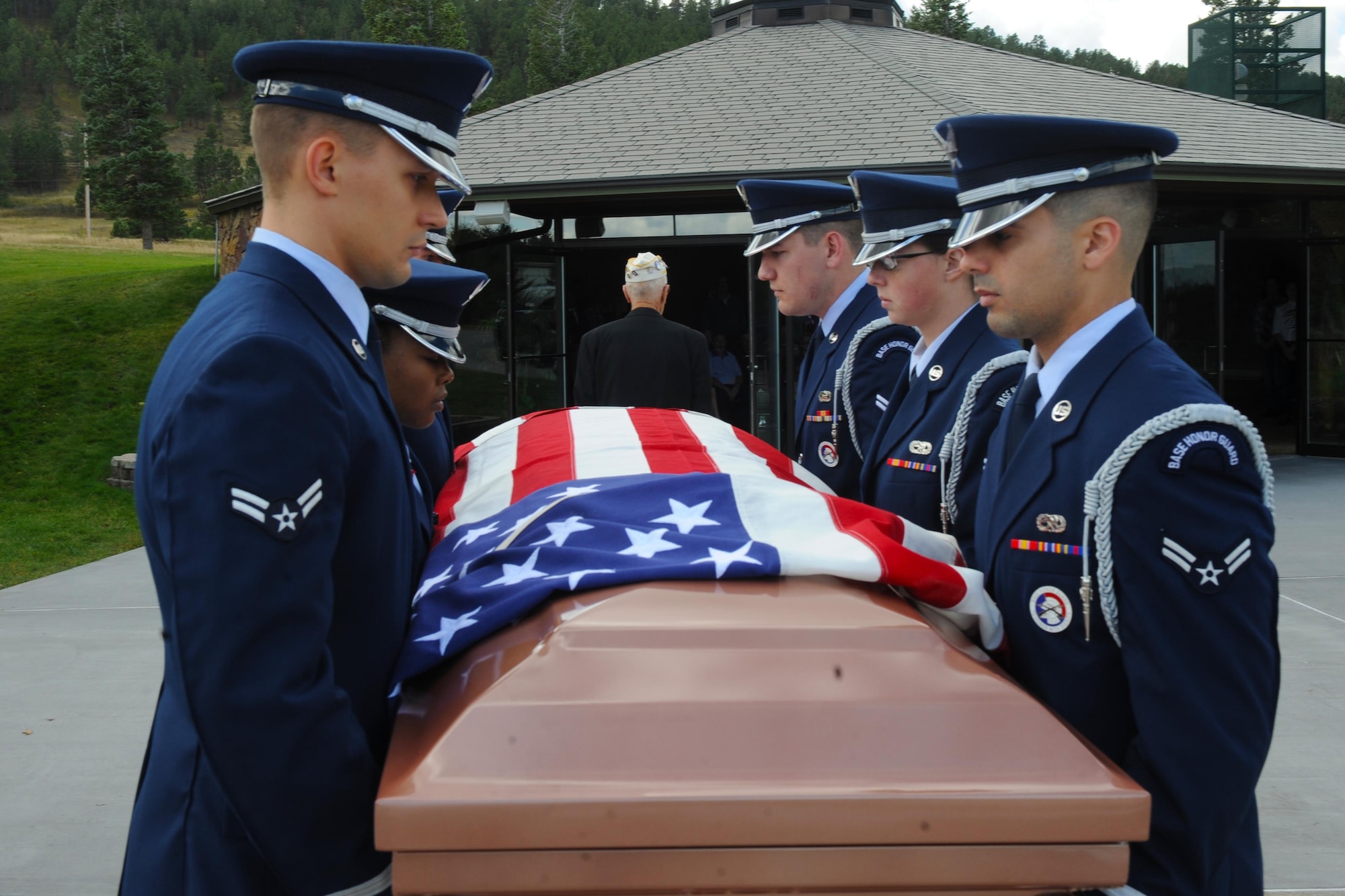 Airmen from the Ellsworth Air Force Base Honor Guard carry the remains of a retired service member during a funeral at Black Hills National Cemetery in Sturgis, S.D., Sept. 26, 2017. Ellsworth’s honor guard covers 114,603 miles and 81 counties throughout South Dakota, Wyoming and Nebraska. (U.S. Air Force photo by Airman Nicolas Z. Erwin)