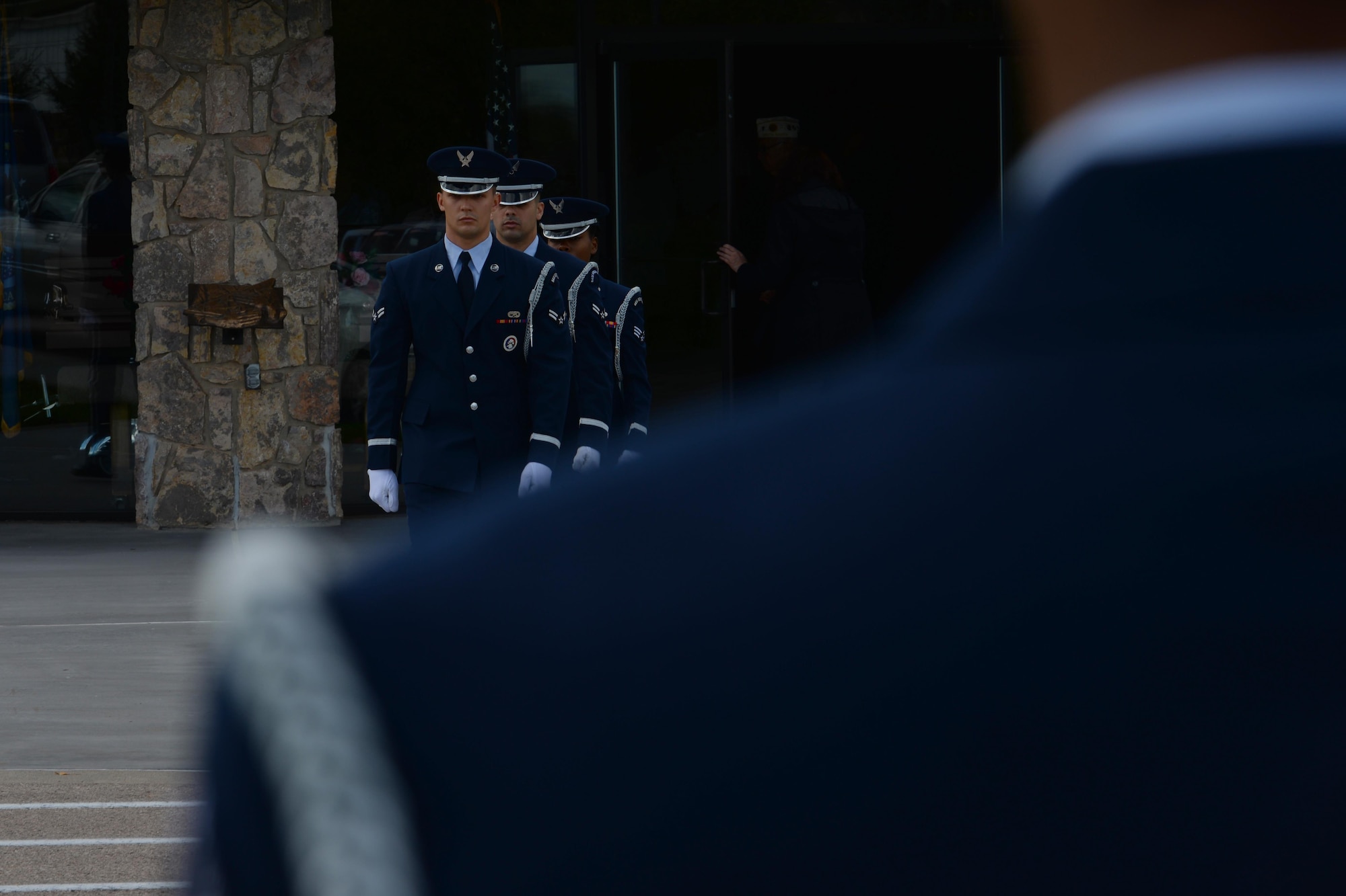 Airmen from Ellsworth Air Force Base, S.D., march to the firing line to perform military honors during a funeral at Black Hills National Cemetery in Sturgis, S.D., Sept. 26, 2017. Following the flag folding sequence, three members of the detail will depart to the firing line to fire three volleys before Taps plays. (U.S. Air Force photo by Airman Nicolas Z. Erwin)