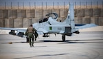 An Afghan A-29 pilot walks toward his aircraft at Kandahar Airfield, Afghanistan.