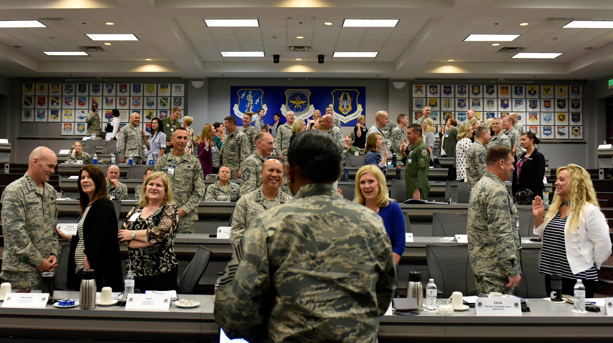 Chief Master Sgt. Shelina Frey, Air Mobility Command command chief watches as spouses read an oath to serve during AMC's fall Phoenix Rally Sept. 27 at Scott Air Force Base, Ill.