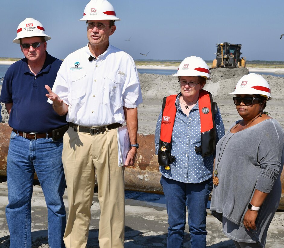 From left, Rep. Greg Haney (R-Gulfport) stands in the background as Delbert Hosemann, Mississippi secretary of state, describes how the Cat Island restoration project came about to those in attendance at a press conference held Sept. 29. From left, Susan Rees, project manager, Mobile District’s Coastal Resiliency Program, and Rep. Sonya Williams-Barnes (D-Gulfport) stand to Hosemann’s right.