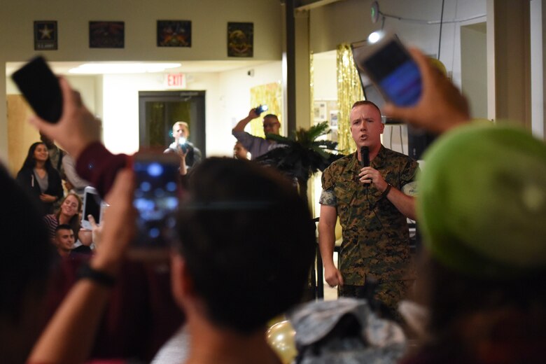 U.S. Marine Pfc. Jared Armes, Marine Corps Detachment trainee, sings “My Way” by Frank Sinatra at the Talent Show at the Crossroads on Goodfellow Air Force Base, Texas, Sept. 29, 2017. During Armes’ performance the crowd began using their phone’s flashlights as lighters. (U.S. Air Force photo by Airman Zachary Chapman/Released)