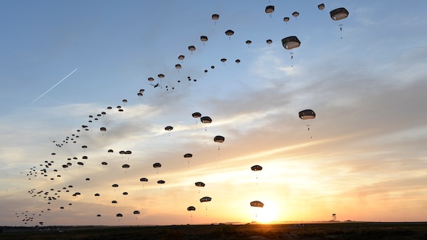 U.S. Army and British paratroopers perform a static-line jump at Holland Drop Zone in preparation for Combined Joint Operational Access Exercise 15-01 at Fort Bragg, N.C., April 11, 2015. Combined Joint Operational Access Exercise 15-01 is an 82nd Airborne Division-led bilateral training event at Fort Bragg, N.C., taking place April 13-20, 2015. This is the largest exercise of its kind held at Fort Bragg in nearly 20 years and demonstrates interoperability between U.S. Army and British Army soldiers, U.S. Air Force, Air National Guard and Royal Air Force airmen and U.S. Marines. (U.S. Air Force photo by Staff Sgt. Sean Martin/Released)