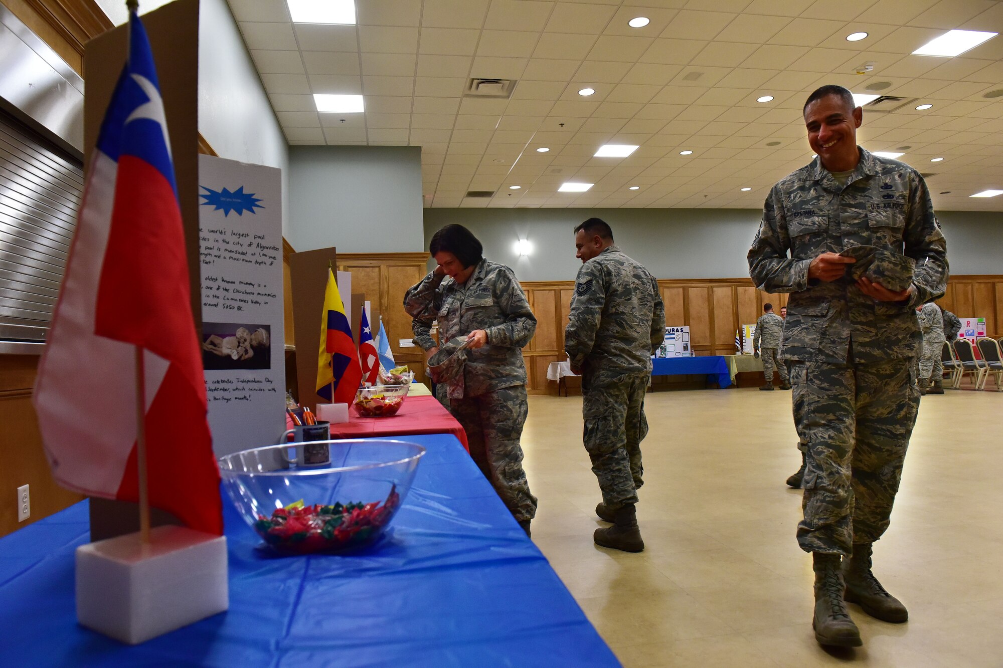 Attendees of the Hispanic Heritage Month Info Fair peruse booths featuring different Hispanic countries Sept. 29, 2017, at Walter’s Community Support Center on Little Rock Air Force Base, Ark. Each booth had information describing how different Hispanic countries helped shape the United States. (U.S. Air Force photo by Airman Rhett Isbell)