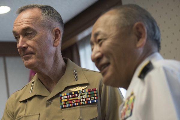 Marine Corps Gen. Joseph F. Dunford Jr., chairman of the Joint Chiefs of Staff, meets with Japan Self-Defense Force Adm. Katsutoshi Kawano, Chief of Staff, Joint Staff, at the Ministry of Defense in Tokyo, Aug. 18, 2017. (DOD photo by U.S. Navy Petty Officer 1st Class Dominique A. Pineiro)