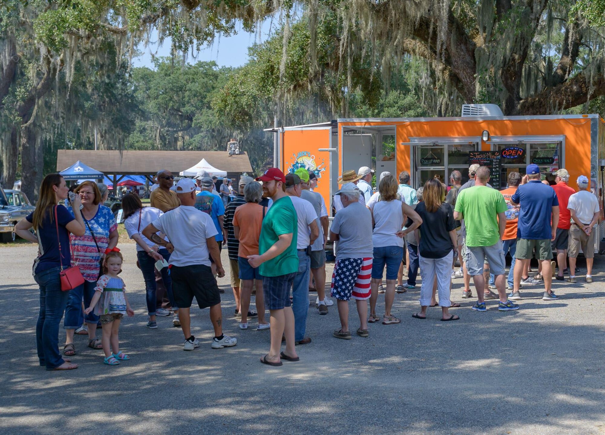 Visitors wait in line to purchase food and beverages at a concession stand at The Marina Park during the 14th Annual Cruisin’ Keesler Car Show Sept. 30, 2017, on Keesler Air Force Base, Mississippi. The annual car show is held to kick off Cruisin’ the Coast, a festival to celebrate classic cars, trucks and hot rods, where vehicles cruise down the 30-mile beachside highway in Mississippi.  There were over 300 visitors and 130 classic vehicle entries with 15 awards presented. (U.S. Air Force photo by Andre’ Askew)