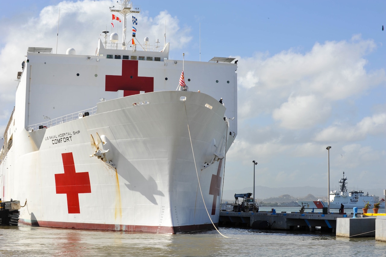 The USNS Comfort pulls up to the dock.