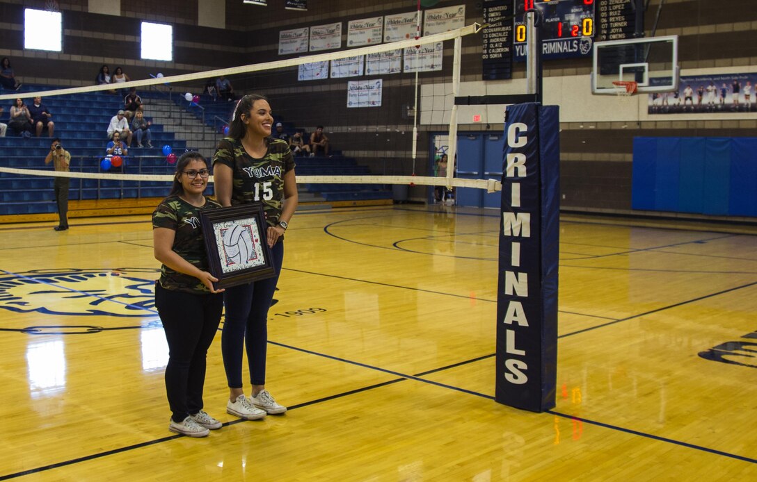 Yuma High School students and teachers recognize U.S. Marines, stationed at Marine Corps Air Station Yuma, Ariz., during their Military Appreciation Night volleyball game at Yuma High School, Yuma, Ariz., Sept. 11, 2017. The Yuma High School Girls Volleyball team hosted the event to thank those who have and are serving the country. (U.S. Marine Corps photo taken by Lance Cpl. Jonah White)