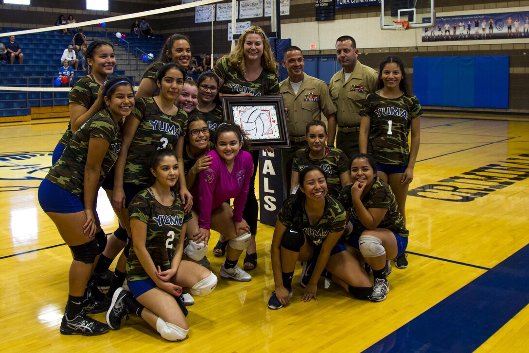 Yuma High School students and teachers recognize U.S. Marines, stationed at Marine Corps Air Station Yuma, Ariz., during their Military Appreciation Night volleyball game at Yuma High School, Yuma, Ariz., Sept. 11, 2017. The Yuma High School Girls Volleyball team hosted the event to thank those who have and are serving the country. (U.S. Marine Corps photo taken by Lance Cpl. Jonah White)