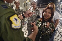 Sandrea Hershey, 14 years old, tours a C-17 Globemaster III alongside Airmen of the 437th Airlift Wing during an Airman for a Day event here, Oct. 2, 2017. The event was hosted by the 628th Air Base Wing and 437th AW.  Hershey was diagnosed with cancer in 2015 and spent approximately 170 days in a hospital. Despite her diagnosis Hershey kept up with her school work and finished her final treatment last month. Sandrea, her mother Lori Hershey, and her friend Justin Pippin, also 14 years old, met 628th Security Forces Squadron Phoenix Raven members, observed a military working dog demonstration and tested their piloting skills in a C-17 flight simulator. (U.S. Air Force photo by Staff Sgt. Christopher Hubenthal)