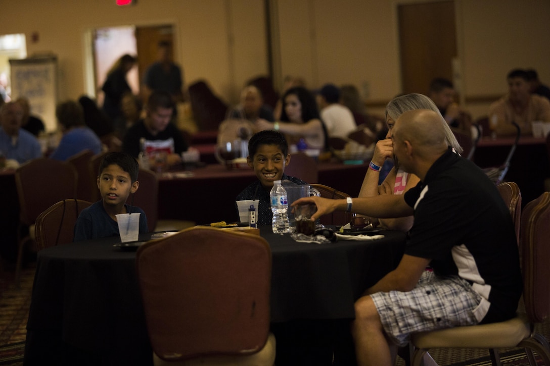 U.S. Marines and Sailors stationed at Marine Corps Air Station Yuma, Ariz., gather at the Sonoran Pueblo on Sept. 16, 2017, to watch the Canelo Alvarez and Gennady Golovkin boxing match. Marine Corps Community Services planned the event for Marines, Sailors and their families to watch and enjoy together. (U.S. Marine Corps photo taken by Lance Cpl. Sabrina Candiaflores)