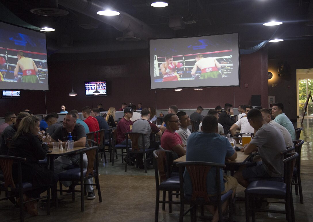 U.S. Marines and Sailors stationed at Marine Corps Air Station Yuma, Ariz., gather at the Sonoran Pueblo on Sept. 16, 2017, to watch the Canelo Alvarez and Gennady Golovkin boxing match. Marine Corps Community Services planned the event for Marines, Sailors and their families to watch and enjoy together. (U.S. Marine Corps photo taken by Lance Cpl. Sabrina Candiaflores)