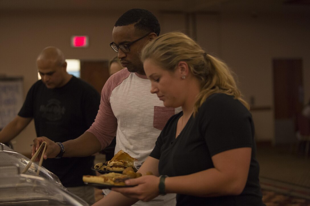 U.S. Marines and Sailors stationed at Marine Corps Air Station Yuma, Ariz., gather at the Sonoran Pueblo on Sept. 16, 2017, to watch the Canelo Alvarez and Gennady Golovkin boxing match. Marine Corps Community Services planned the event for Marines, Sailors and their families to watch and enjoy together. (U.S. Marine Corps photo taken by Lance Cpl. Sabrina Candiaflores)