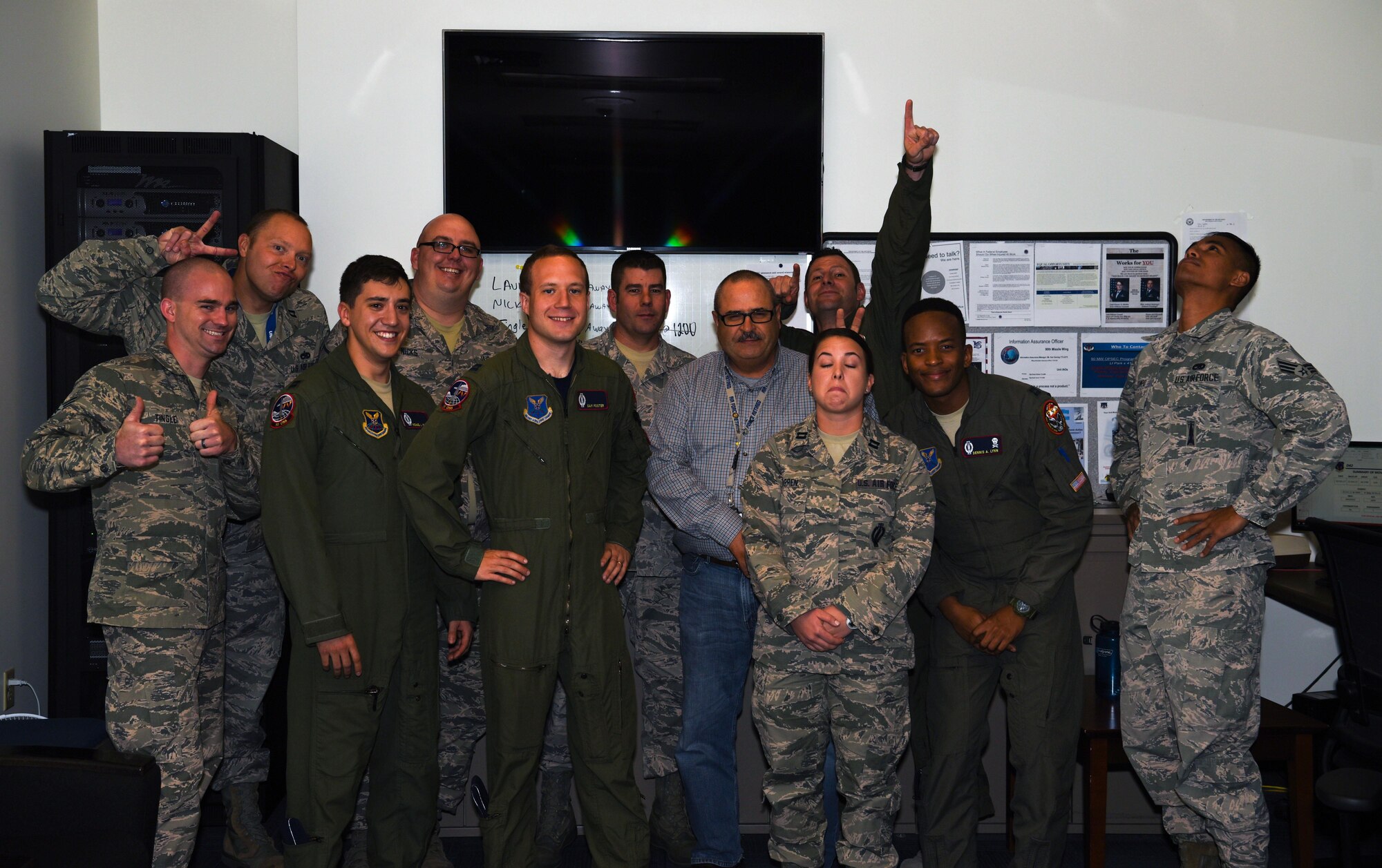 Members of the codes flight on F.E. Warren Air Force Base pose for a photo sept. 29, 2017. Through programming and requiring more than one person to control coded equipment, the codes flight directly contributes to F.E. Warren’s nuclear surety.